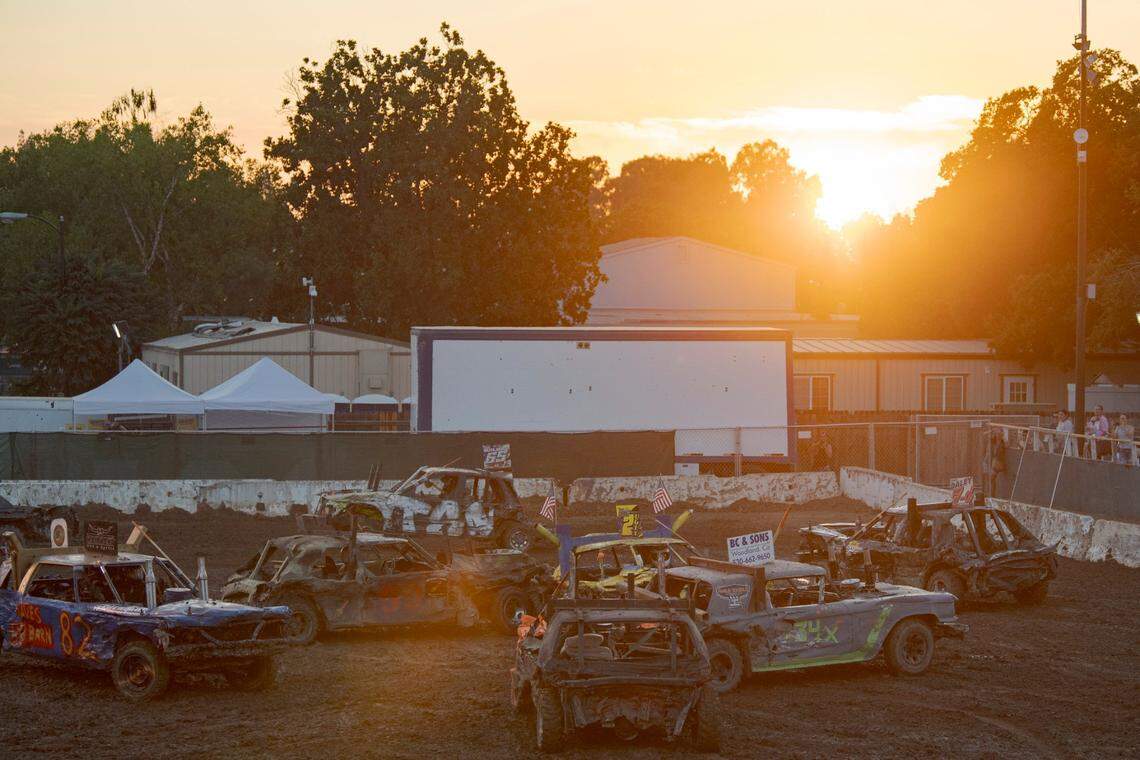 The sun sets during the demolition derby at Rodeo Arena inside the California State Fair on Saturday, July 22, 2023, in Sacramento.