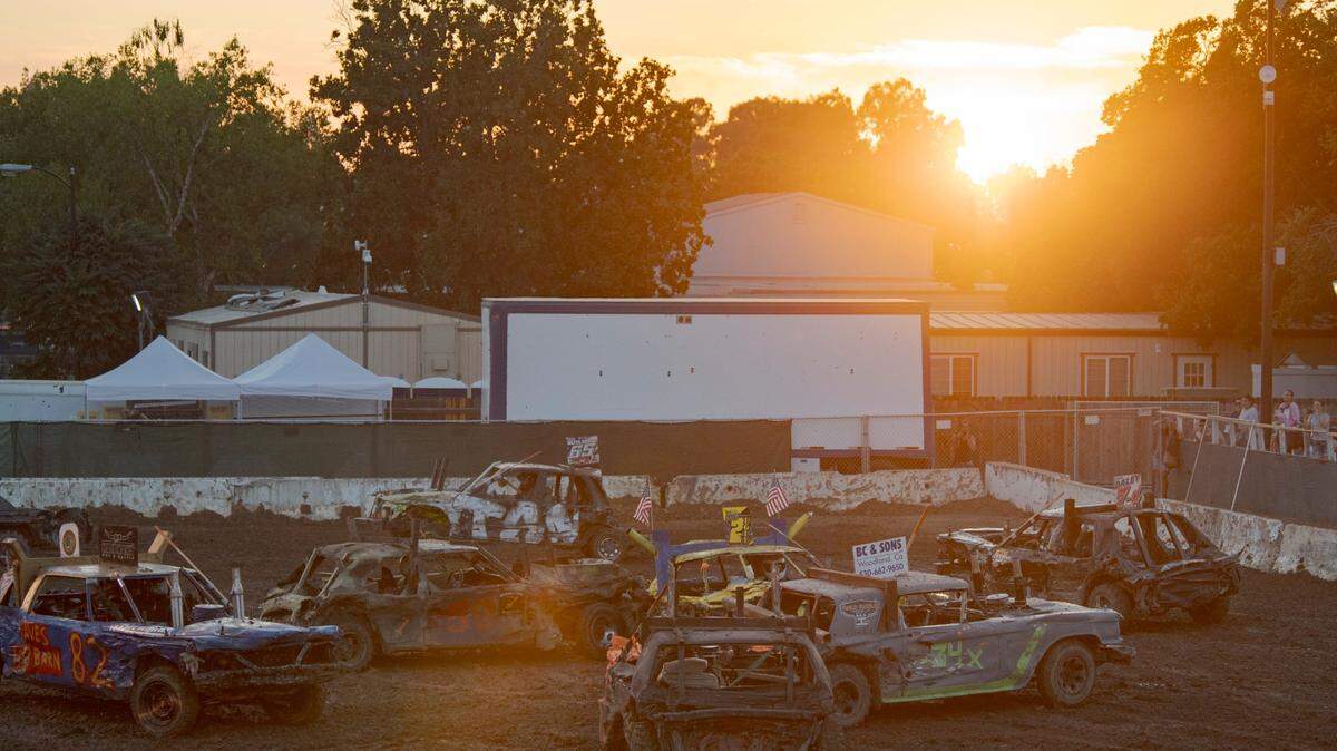 The sun sets during the demolition derby at the California State Fair on on July 22.