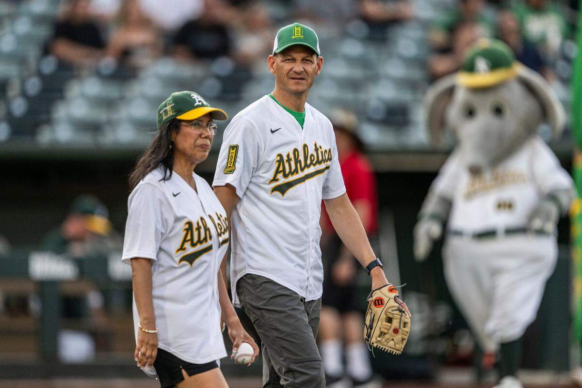 West Sacramento Mayor Martha Guerrero and Sacramento Mayor Kevin McCarty prepare to throw the first pitch during a MLB game at Sutter Health Park between the Athletics and the Baltimore Orioles on June 6, 2025.