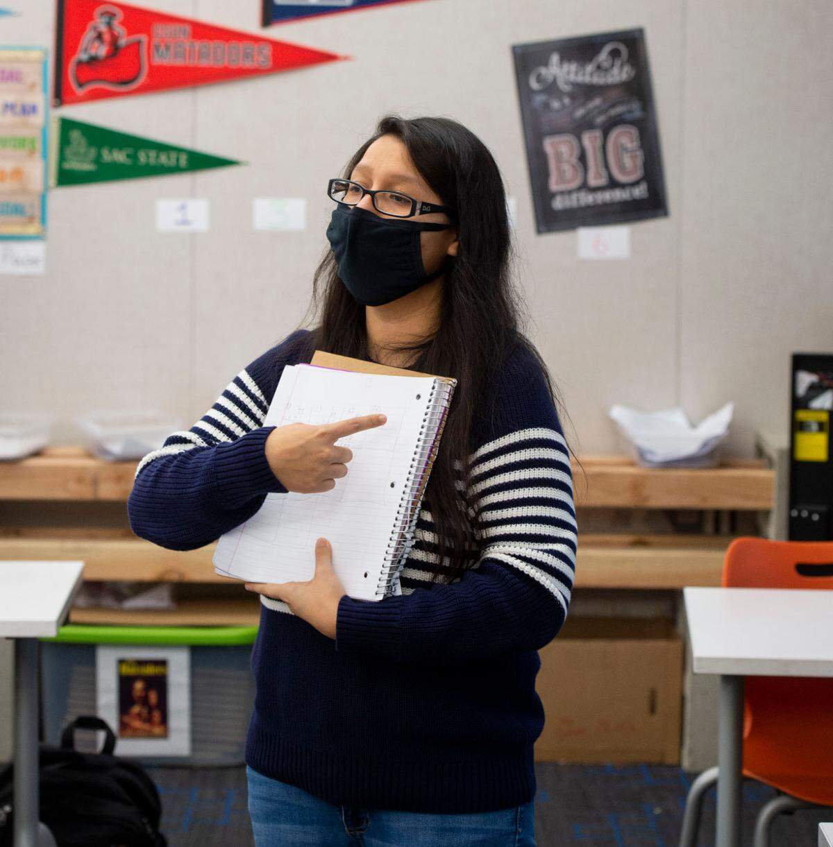 Substitute teacher Laura Jimenez instructs students at Sylvan Middle School in Citrus Heights on Thursday, Dec. 9, 2021. Jimenez worked as a bi-lingual instructional assistant and now subs while she is working to get her teaching credential.