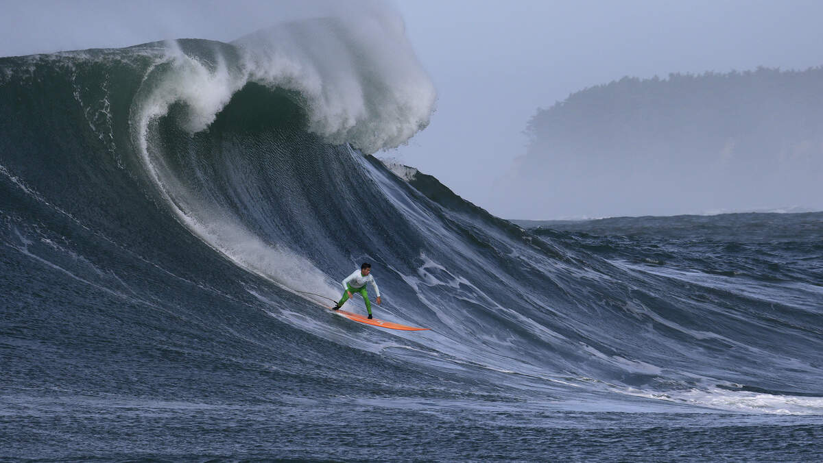 Nic Lamb rides a wave during the Mavericks surfing contest in Half Moon Bay in 2016. A storm near the Aleutian Islands will produce swells up to 30 feet at Northern California beaches New Year’s Eve and New Year’s Day, the National Weather Service says.