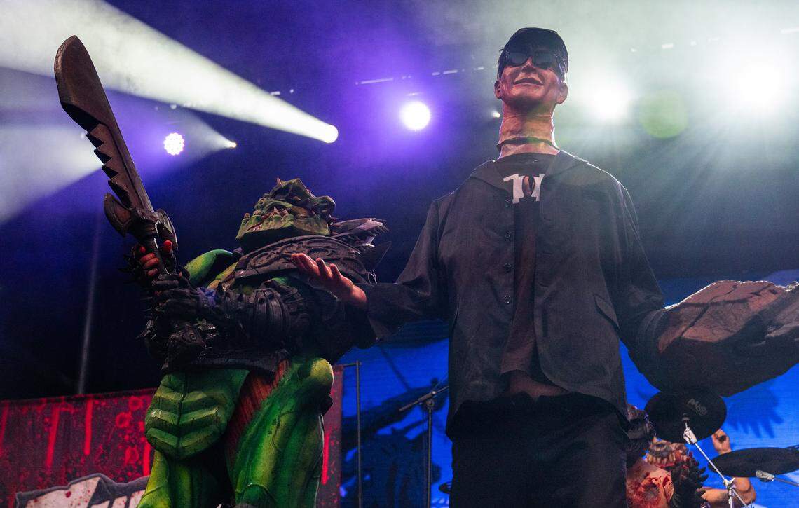 Gwar’s Bonesnapper prepares to decapitate a character playing entrepreneur Elon Musk during the heavy metal band’s set at the Aftershock festival on Sunday, Oct. 5, 2025, in Sacramento’s Discovery Park.