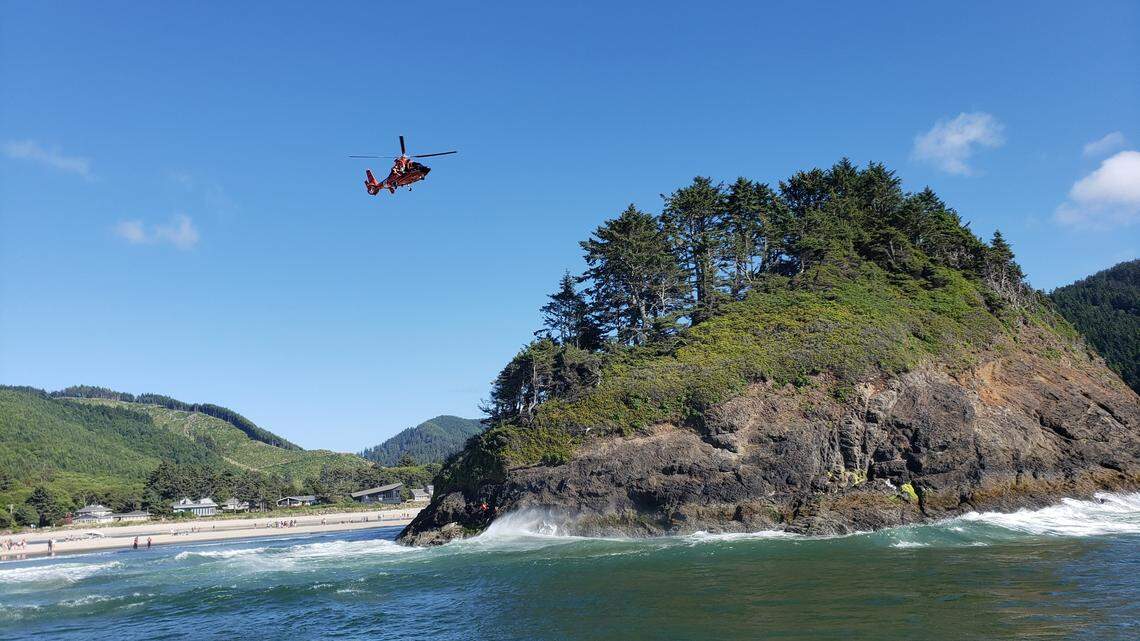 A U.S. Coast Guard helicopter rescued an 18-year-old man who became stuck on Proposal Rock and a bystander who tried to help in Oregon.