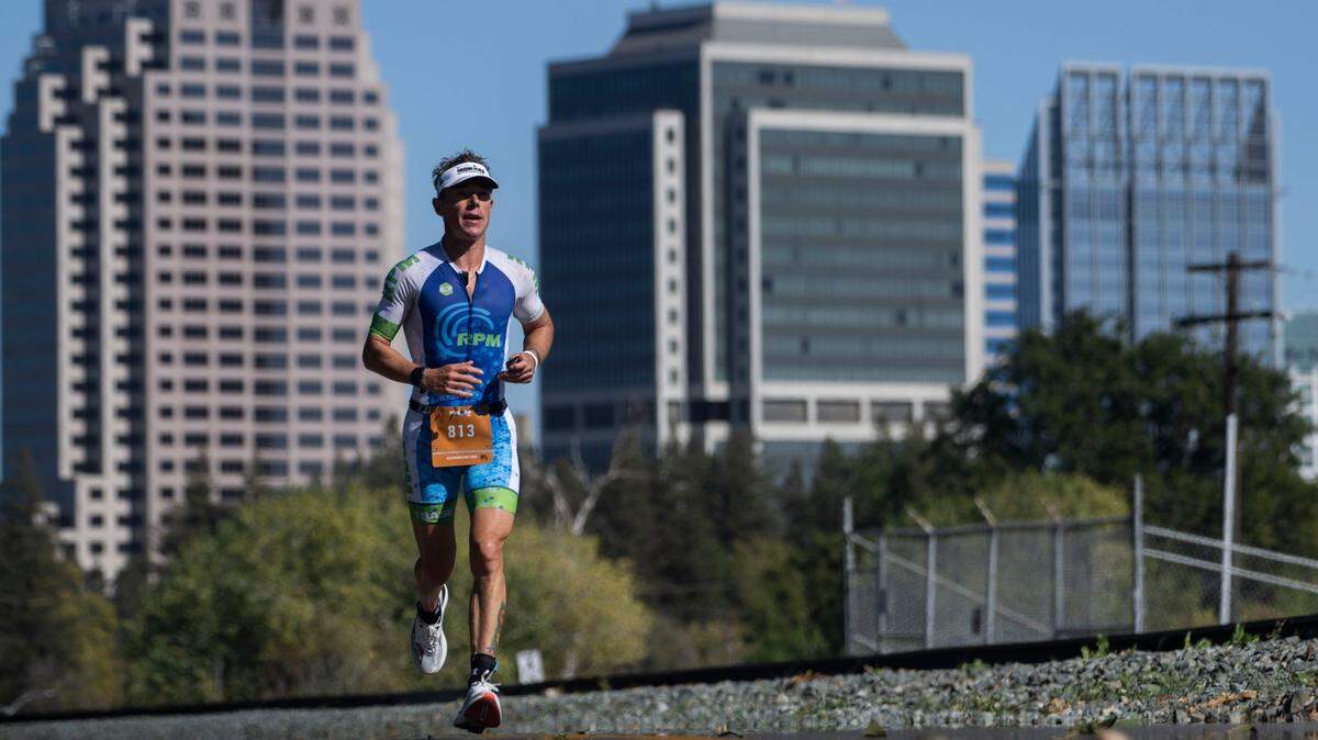 Wim Van de Wielle of Zele, Belgium, runs past the Sacramento skyline in October 2022.