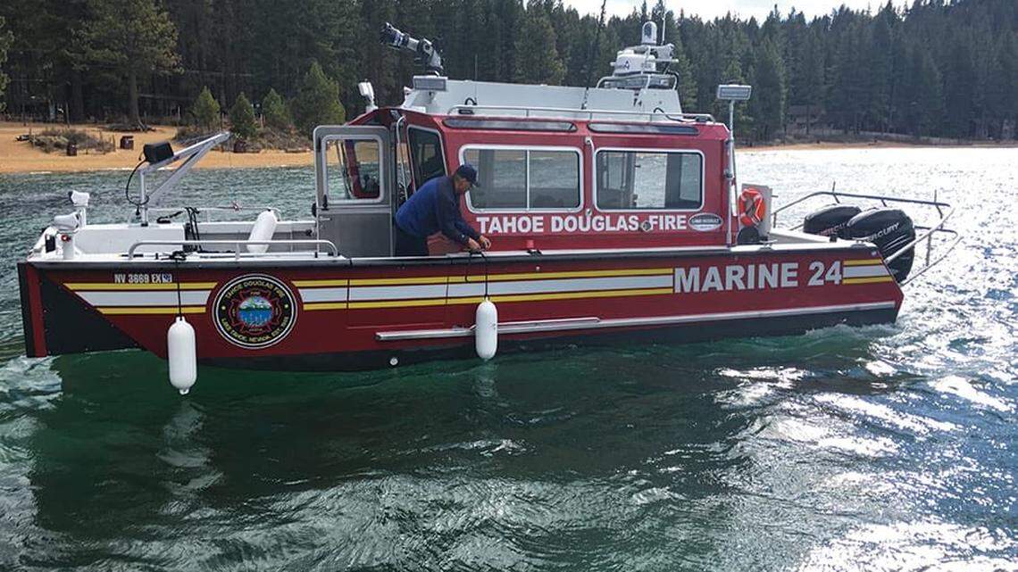 A woman drowned and a man was in critical condition after a boating accident on Lake Tahoe left six children stranded on a boat.