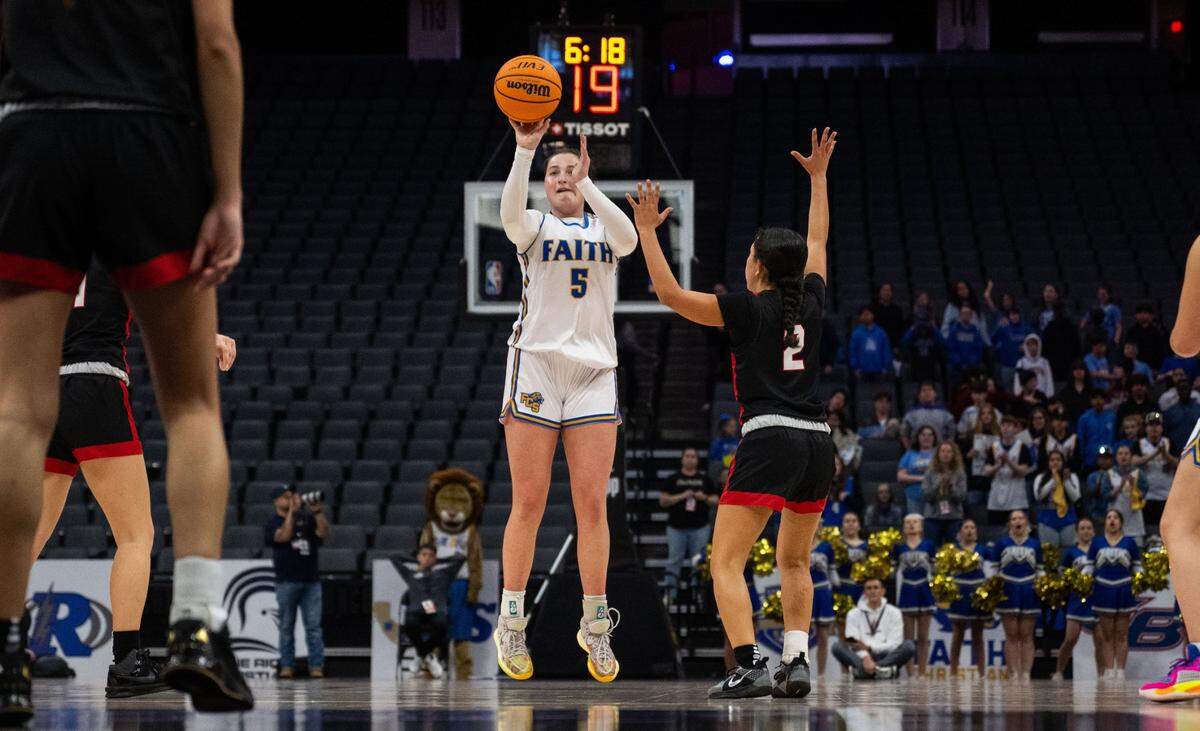 The Faith Christian Lions’ Lauren Harris (5) hits a 3-point basket against the Sacramento Adventist Capitals during the CIF Sac-Joaquin Section Division VI girls basketball championship game at Golden 1 Center on Feb. 27. Harris is The Bee's Smallest School Player of the Year. 