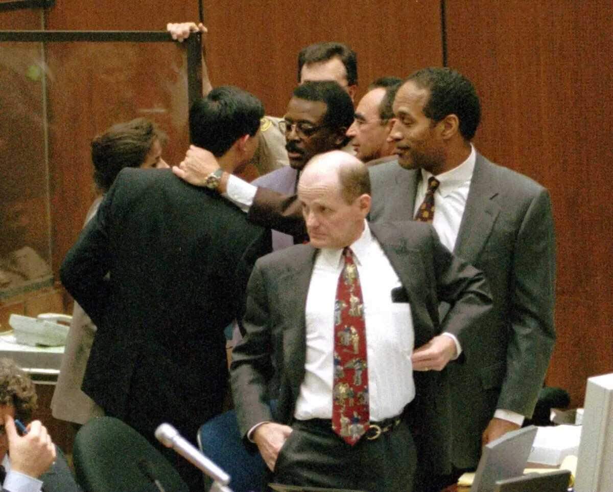 Defense attorney Robert Blasier, foreground, stands with O.J. Simpson as the rest of the football star’s defense team talks with LAPD criminalist and prosecution witness Dennis Fung during Simpson’s trial for the murder of Nicole Brown Simpson and Ronald Goldman. Blasier, who still practices law in the Sacramento area, was instrumental in getting DNA evidence suppressed from the trial.