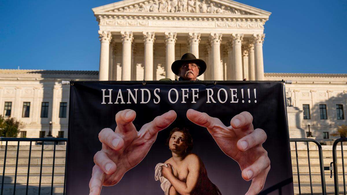 A protester holds a sign outside the Supreme Court in Washington last year.