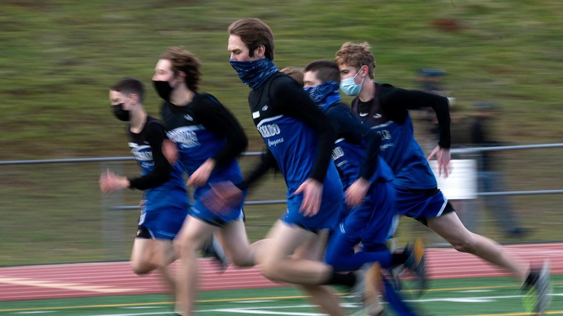 El Dorado High School junior varsity runners warm up at a cross country meet at Union Mine High School on Monday, Jan. 25, 2021 in El Dorado. It was the first high school sporting event in the Sacramento region since March 2020, when the coronavirus pandemic stopped high school sports competitions.
