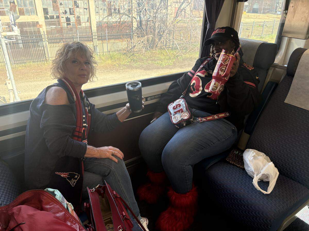 Isis Robinson, right, and Tracy Salvato ride the Amtrak train from Sacramento to Santa Clara before Super Bowl LX on Sunday, Feb. 8, 2026.