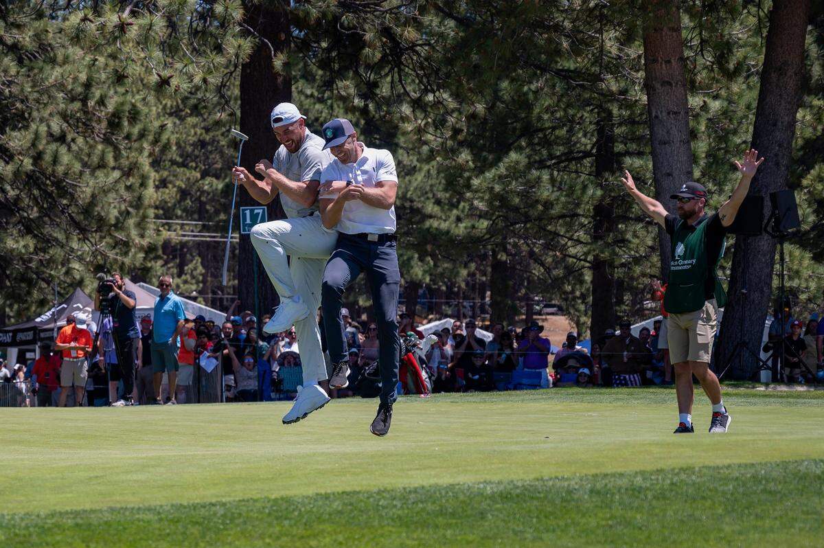 Kansas City Chiefs tight end Travis Kelce, left, and former San Francisco 49ers and Kansas City quarterback Alex Smith celebrate after finishing the eighteenth hole during the American Century Celebrity Golf Championship Tournament at Edgewood Tahoe Golf Course in Stateline, Nev., on Sunday, July 10, 2022. Smith finished tied for 44th; Kelce was 64th.