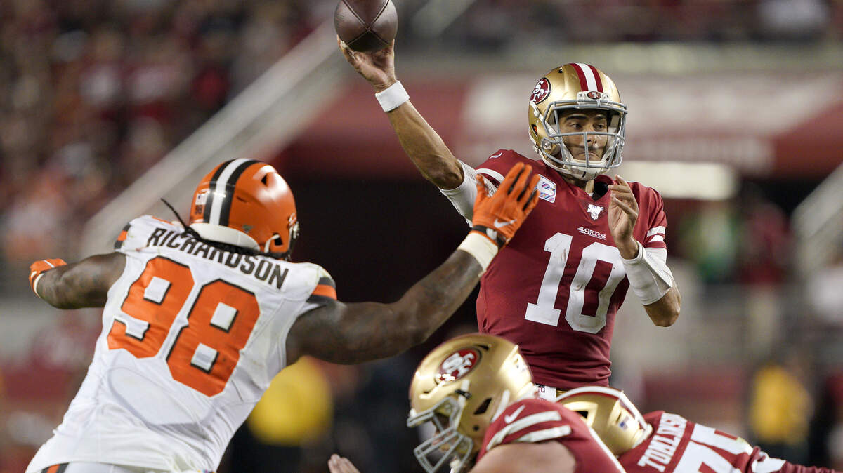 San Francisco 49ers quarterback Jimmy Garoppolo (10) passes as Cleveland Browns defensive tackle Sheldon Richardson (98) applies pressure during the second half of an NFL football game in Santa Clara, Calif., Monday, Oct. 7, 2019. (AP Photo/Tony Avelar)