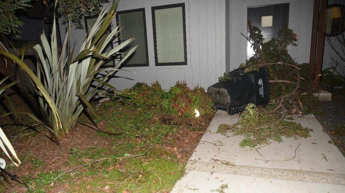 An image from the Sacramento Police Department shows an overturned yard waste container and yard waste barricading the door to the home of Sacramento Mayor Darrell Steinberg on Saturday, Feb. 6, 2021, after it was vandalized by activists.
