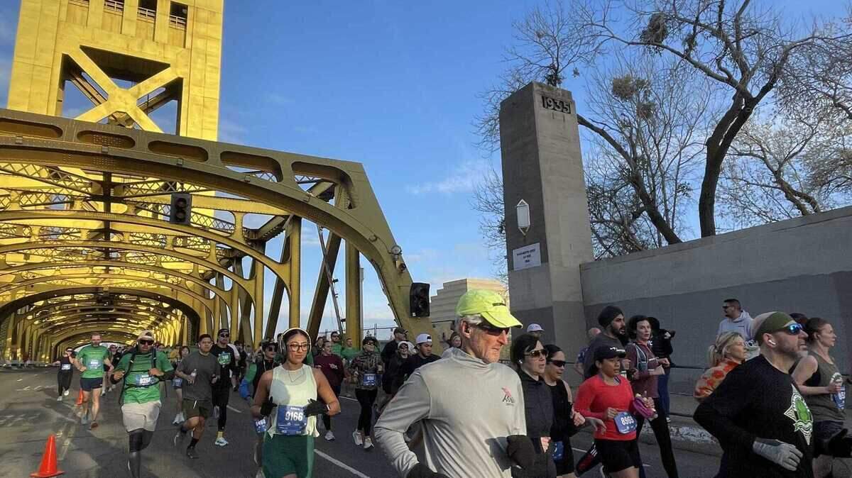 Runners cross Tower Bridge during the annual Shamrock’n Half Marathon on Sunday. 