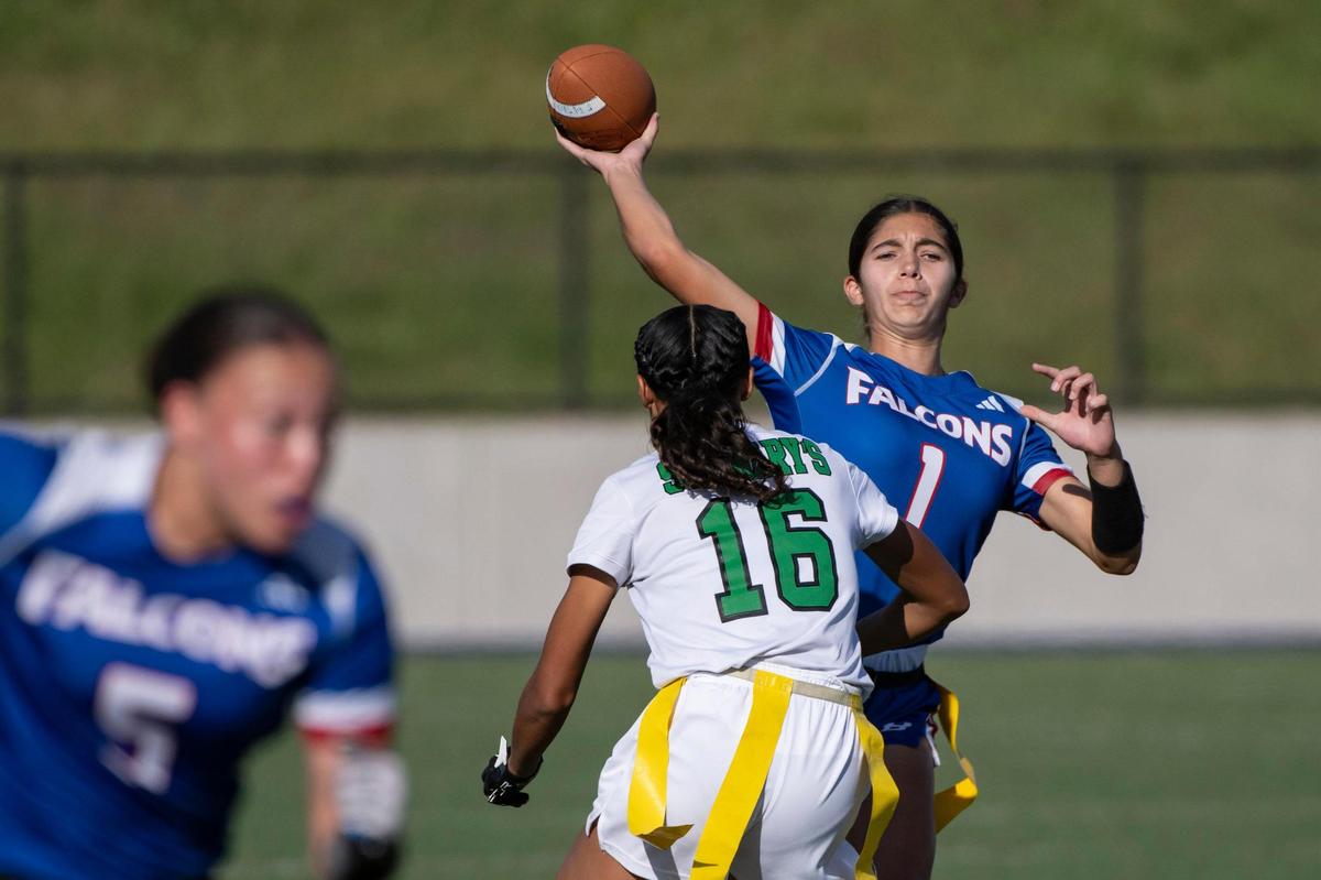 Christian Brothers Falcons quarterback Gabriella Devlin (1) passes under pressure by the St. Mary’s Rams’ Geianna Gonzalez (16) in the 2023 CIF Sac-Joaquin Division II flag football championship.