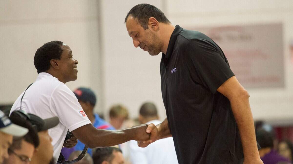 FILE -- NBA Hall of Fame player Isiah Thomas talks with Vlade Divac, Sacramento Kings General Manager, before the Kings game against the Memphis Grizzlies in the 2017 Summer League at the Cox Pavilion in Las Vegas, Nevada on Sunday, July 9, 2017.