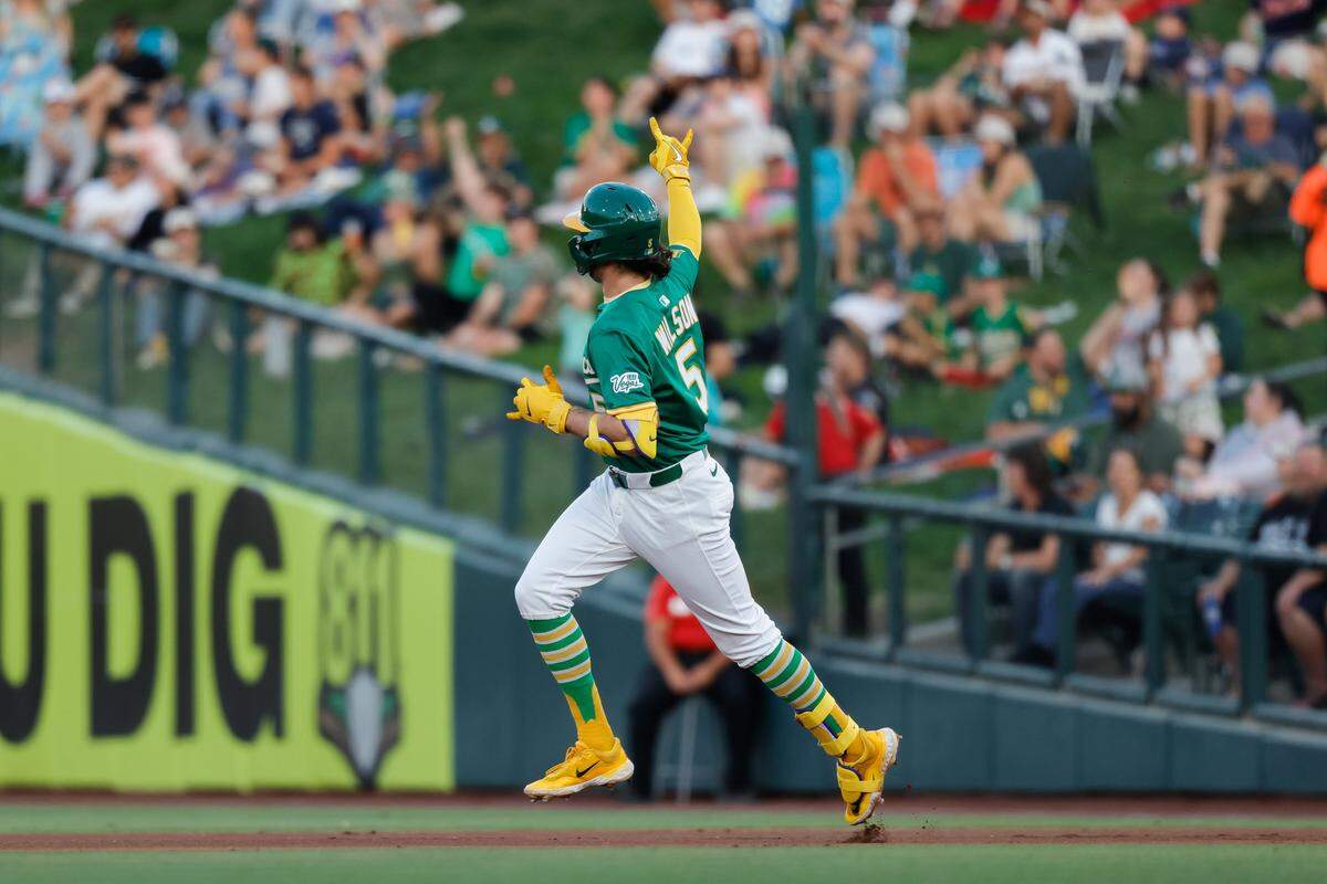 Aug 26, 2025; West Sacramento, California, USA; Athletics shortstop Jacob Wilson (5) rounds the bases after hitting a three run home run during the first inning against the Detroit Tigers at Sutter Health Park. Mandatory Credit: Sergio Estrada-Imagn Images