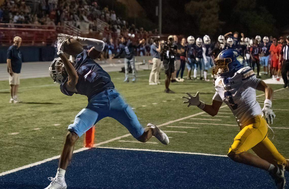 The Destiny Christian Lions’ Titus White (2) makes a touchdown catch in the first half against the Linden Lions on Friday.