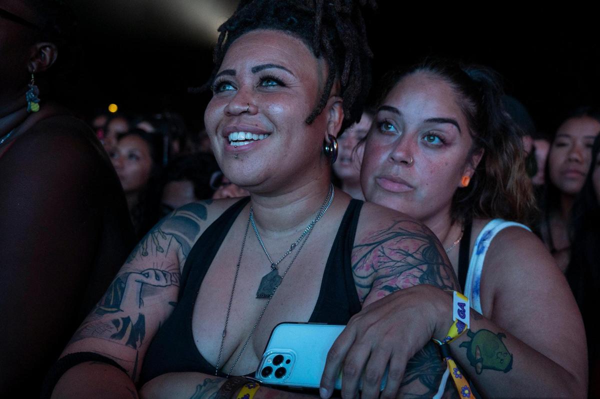 Chanel Harris, left, and her girlfriend Deserea Trasvina, of Sacramento, watch British singer Ella Mai perform on day one of the Sol Blume R&B festival on Saturday.
