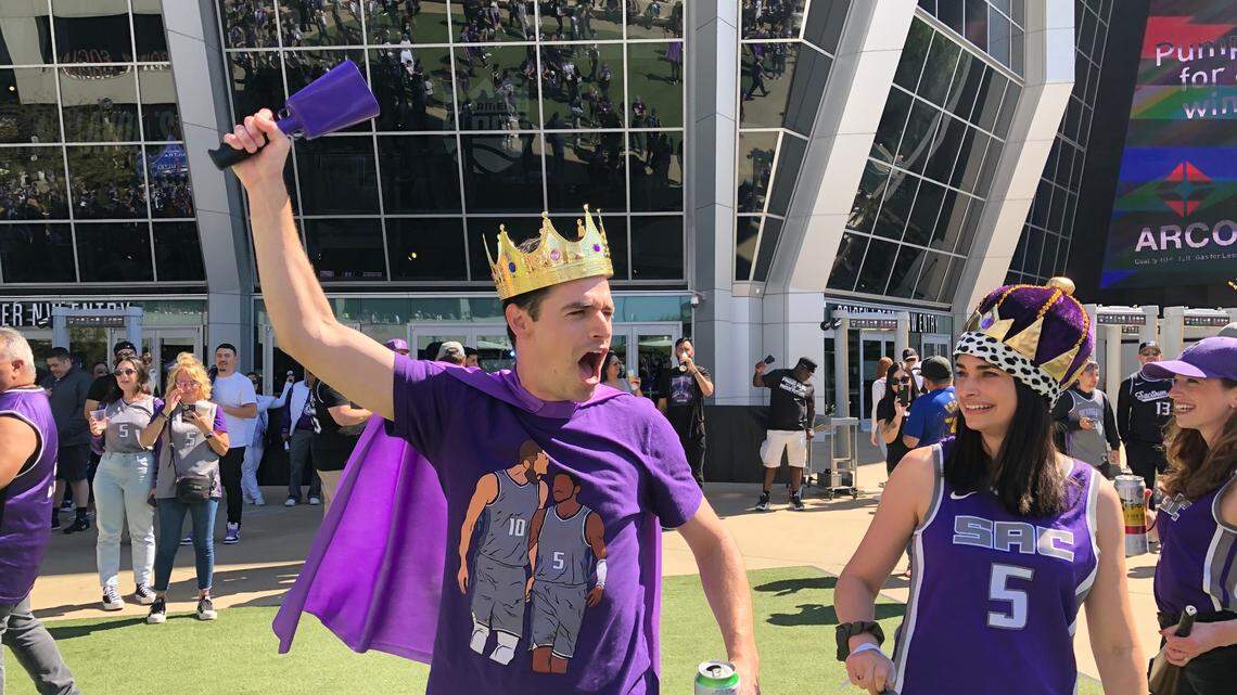 Sacramento Kings fans and siblings Brian and Micaela Birt, of Davis, wear crowns and ring their cowbells at Downtown Commons before the Kings play the Golden State Warriors in the first game of their NBA playoffs series on Saturday, April 15, 2023.