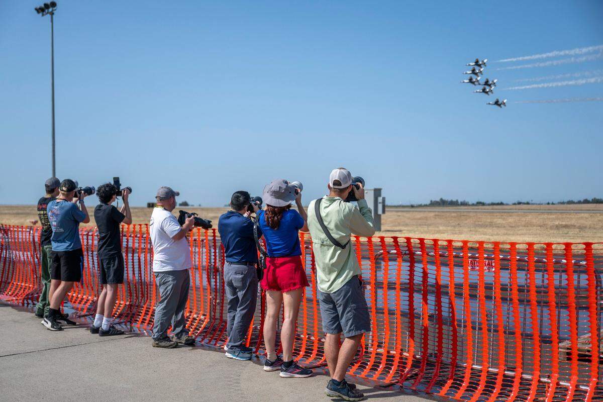 Microinfluencers stand in the reserved media area during the U.S. Air Force Thunderbirds practice flight at the Air & Space Expo at Beale Air Force Base on Friday.