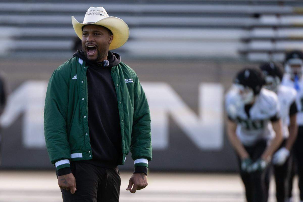 Football coach Brennan Marion leads the team during a spring practice at Sacramento State on Monday, March 17, 2025, in Sacramento. 