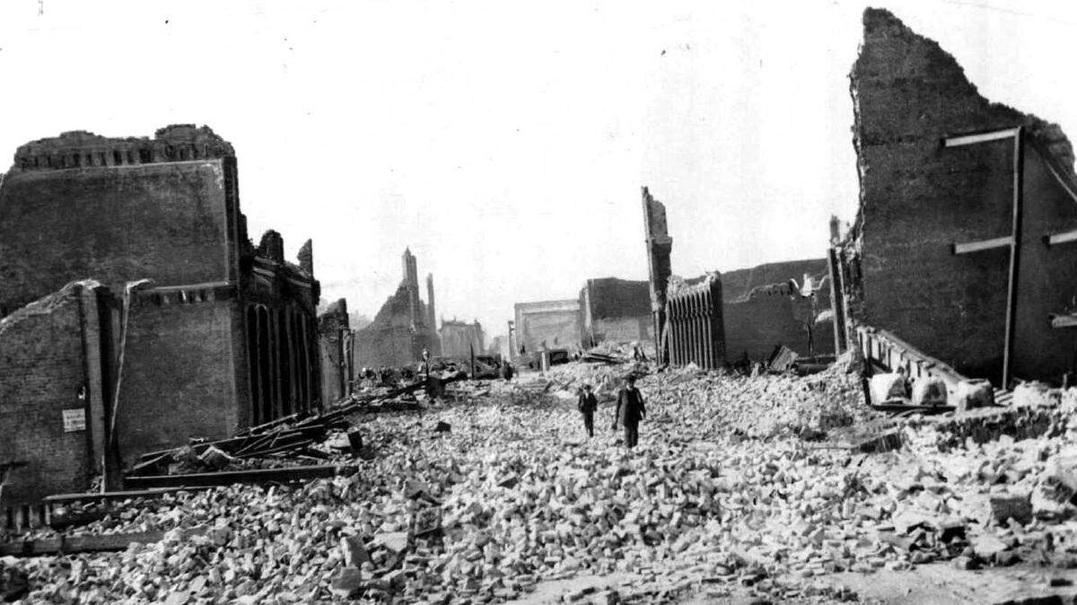 FILE--People walk through the rubble following the 1906 earthquake in San Francisco.
