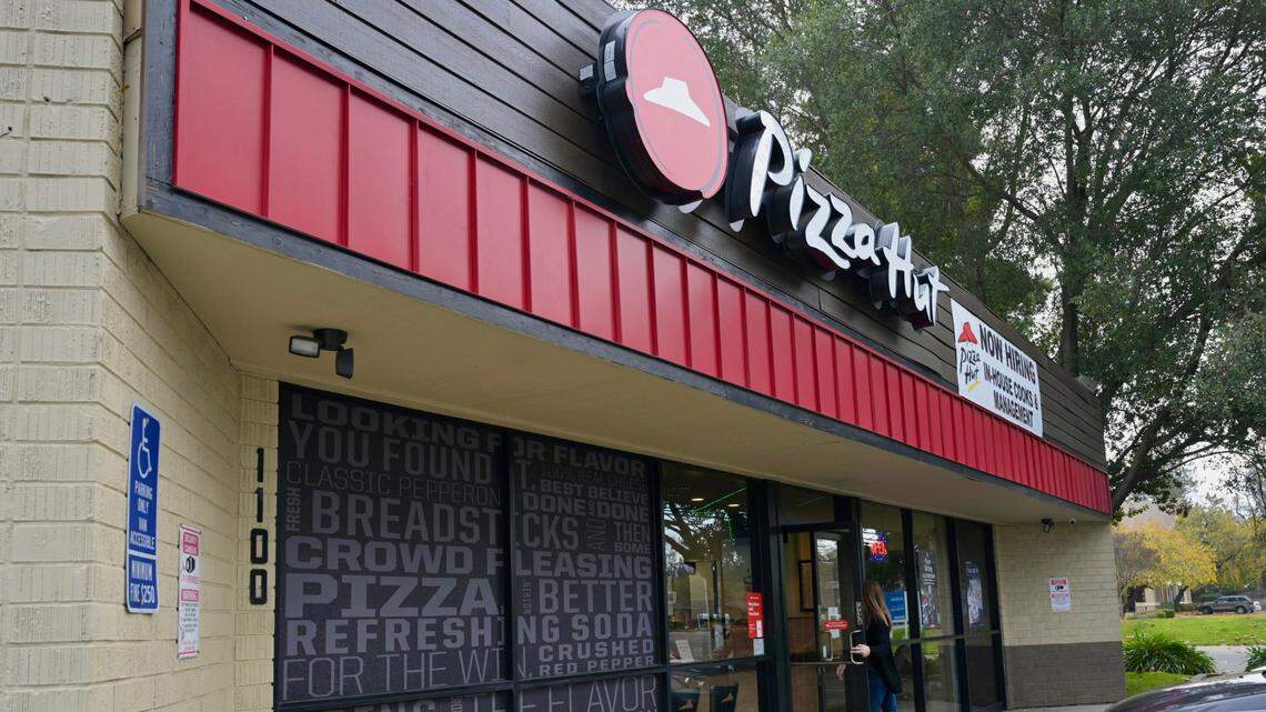A customer enters the Pizza Hut at 1100 Fulton Ave. in Arden Arcade on Wednesday, Dec. 27, 2023. The owner of the Sacramento County franchise is laying off delivery drivers to avoid paying the $20 an hour rate required by a new state law for fast-food workers.