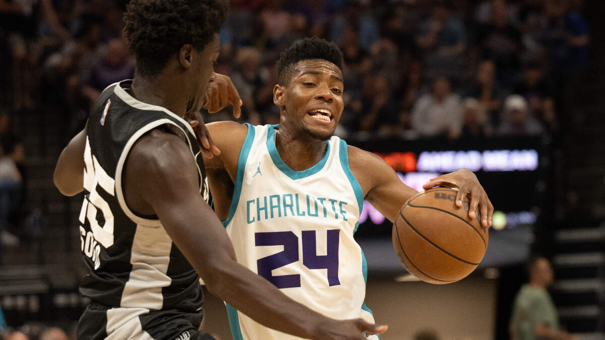 Charlotte Hornets Brandon Miller is fouled by San Antonio Spurs Sidy Cissoko during the California Classic Summer League at Golden 1 Center Monday, July 3, 2023 in Sacramento.