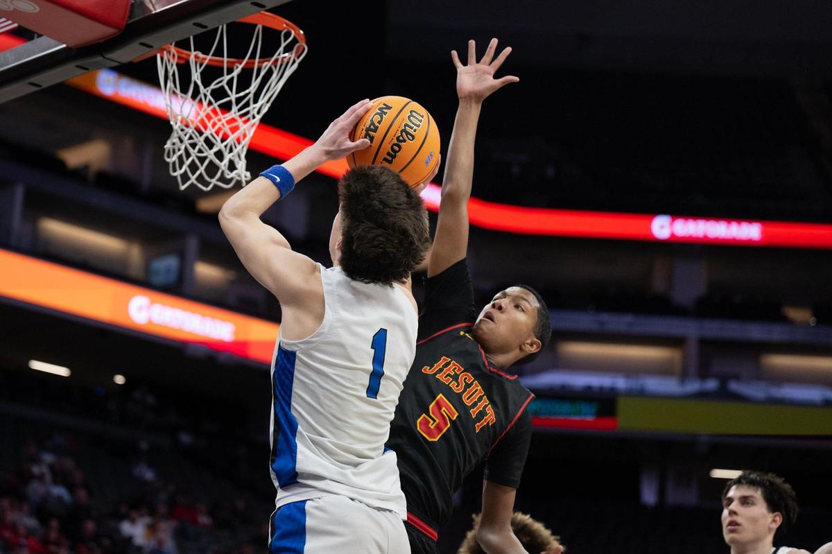 The Rocklin Thunder’s Connor Delaby (1) shoots as the Jesuit Marauders’ Maison Phillips (5) defends in the second half of the CIF Sac-Joaquin Section Division ll championship at Golden 1 Center on Thursday, Feb. 27, 2025. 