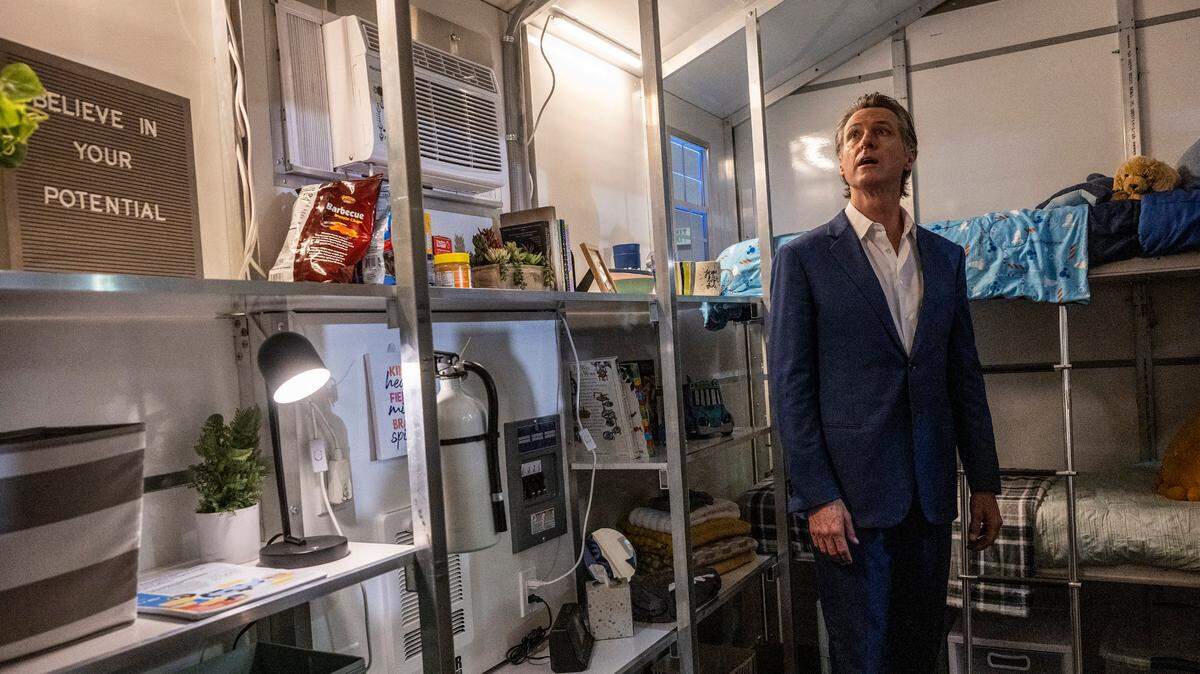 Gov. Gavin Newsom tours a tiny home after announcing Thursday, March 16, 2023, that the state will have 1,200 tiny homes built and delivered throughout California in an effort to help house the homeless population.