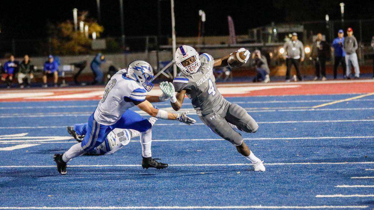 Folsom running back Daniyel Ngata, right, rushed for 70 yards in Folsom’s victory over Rocklin.