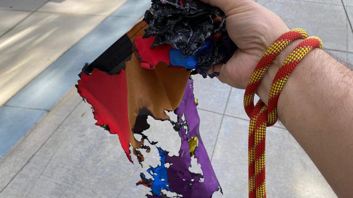 The Rev. Matthew Woodward, dean of the Cathedral at Trinity Cathedral, holds the burned remains of one of his church’s LGBTQ rainbow flags, on Saturday morning, June 5, 2021, in midtown Sacramento.