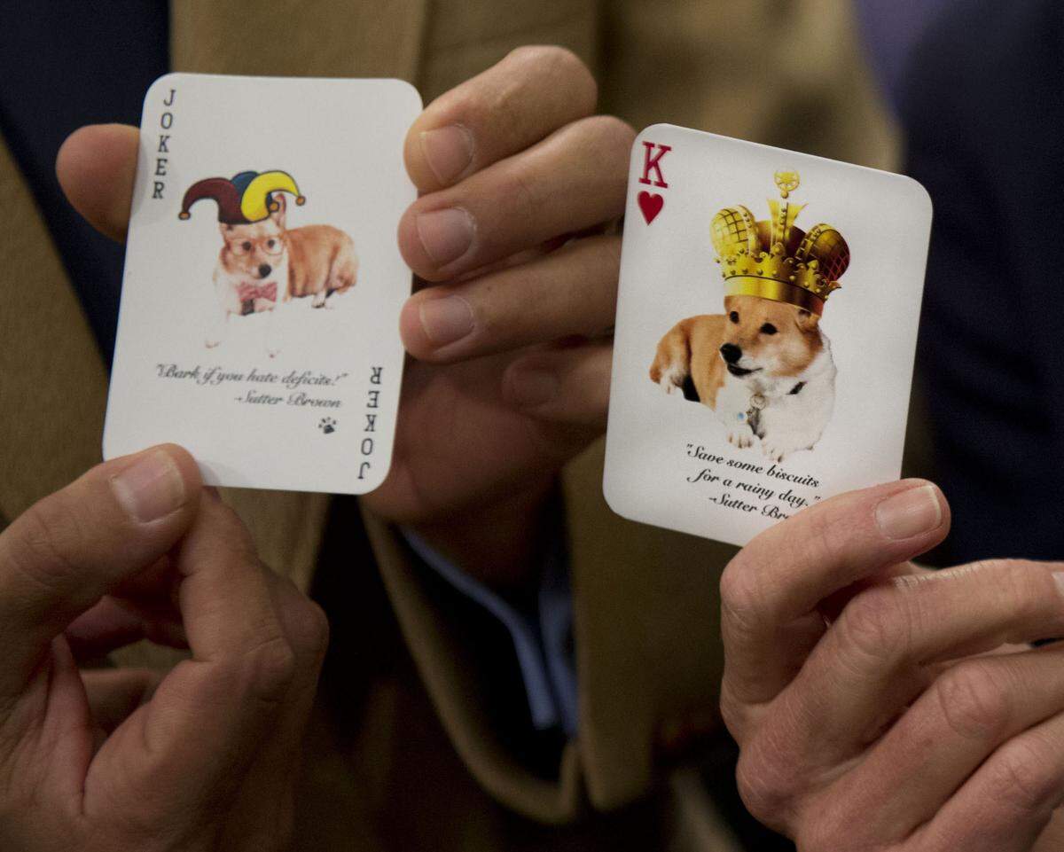 Playing cards featuring first dog Sutter Brown are displayed after Gov. Jerry Brown delivered the 2014 State of the State address.