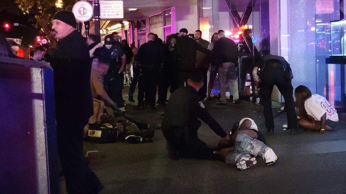 First responders treat victims at the scene of a mass shooting in downtown Sacramento on Sunday.