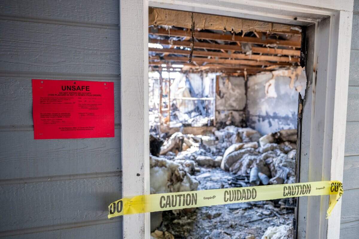 Caution tape blocks a door at Compassion Ranch, which burned last week, in Newcastle on Tuesday. The property once housed aged-out foster youth for a Placer County nonprofit.