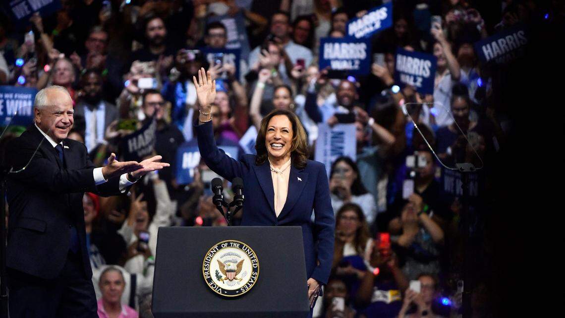 Vice President Kamala Harris stands with her running mate Minnesota Gov. Tim Walz as Harris holds a rally at Temple University in Philadelphia on Aug. 6.