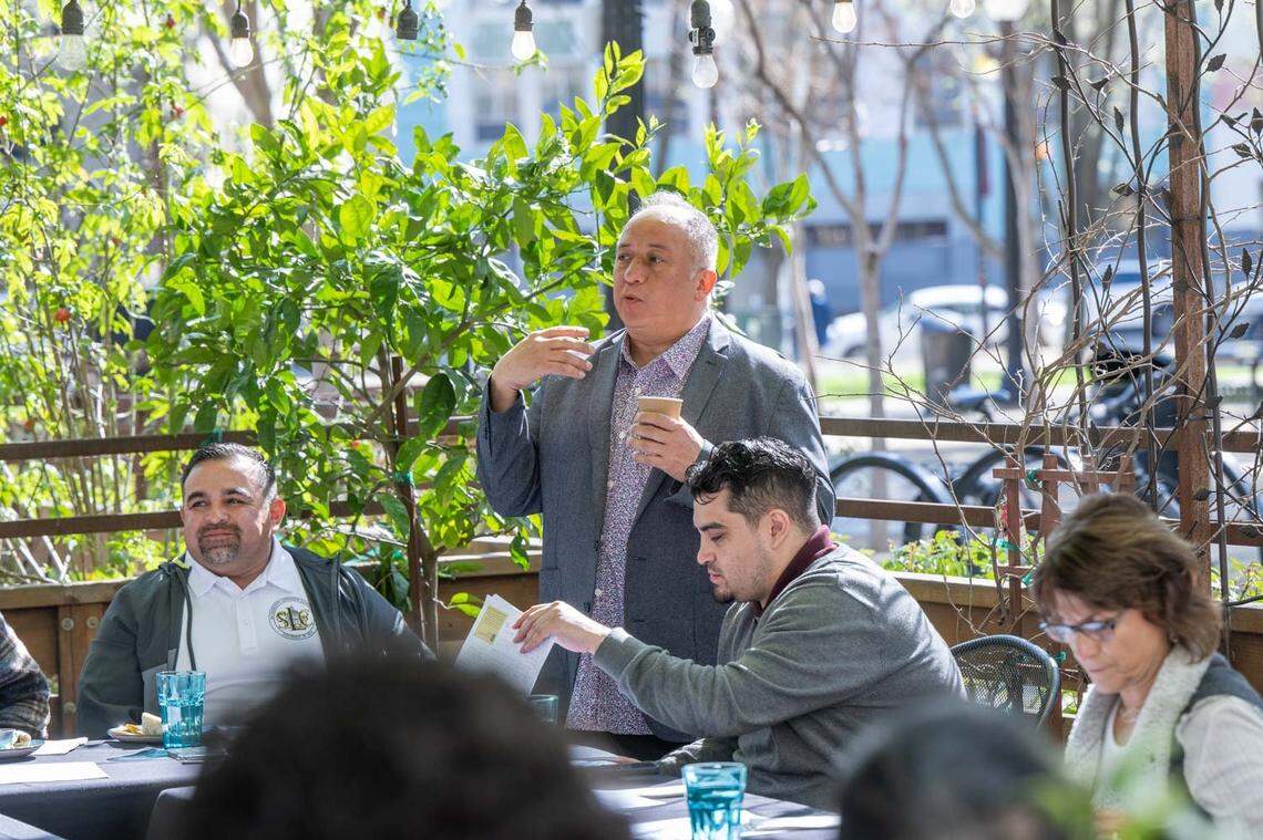 Ernesto Delgado leads a meeting of local business owners and leaders on March 16 at his restaurant La Cosecha at Cesar Chavez Plaza. Delgado has been holding meetings to with the goal of improving the park and making it an inviting place for the whole community.