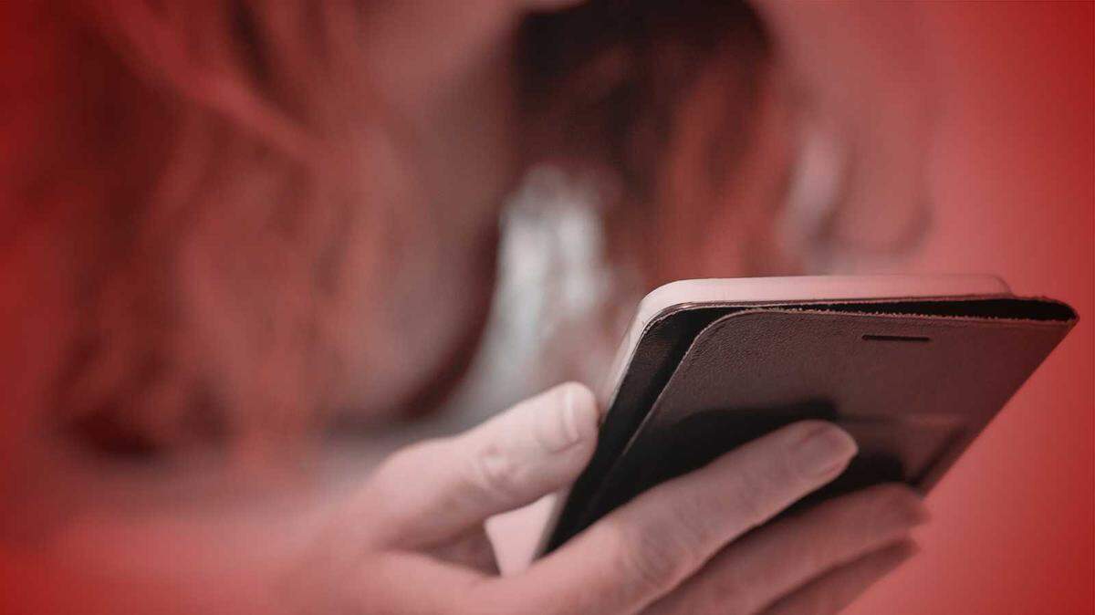 Photoillustration of a woman using a cellphone.