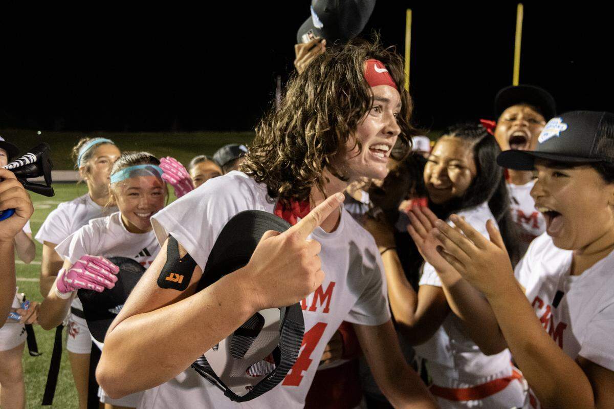 McClatchy Lions quarterback Daisy Throckmorton celebrates with her teammates following the CIF Sac-Joaquin Division I Section Championship flag football game against the West Park Panthers in November.
