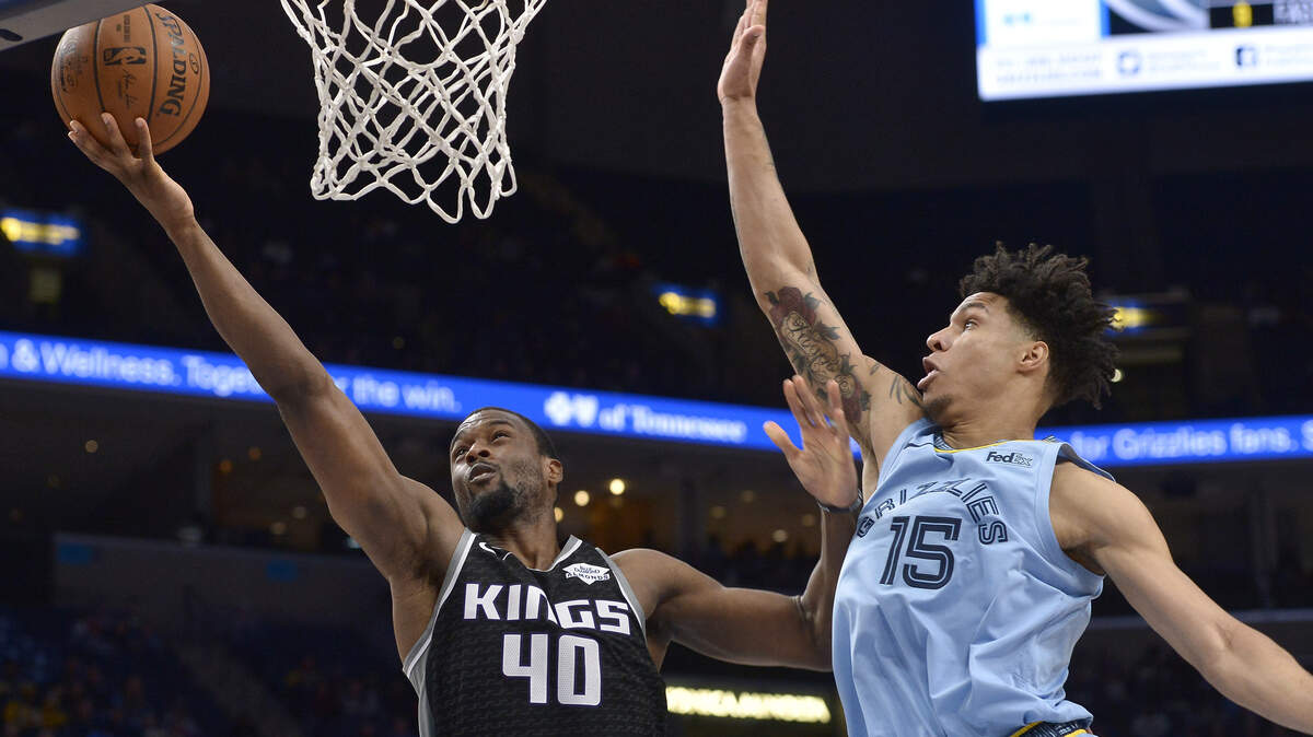 Sacramento Kings forward Harrison Barnes (40) shoots against Memphis Grizzlies forward Brandon Clarke (15) in the first half of an NBA basketball game Saturday, Dec. 21, 2019, in Memphis, Tenn. (AP Photo/Brandon Dill)