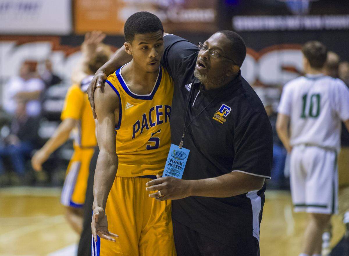 Grant Pacers head coach Deonard Wilson hugs a player after he fouled against the St. Mary’s Rams in the 2018 CIF Division II Sac-Joaquin Section title game at the Spanos Center at the University of the Pacific. Wilson bowed out of his role as Grant boys basketball head coach after the 2025-26 season.