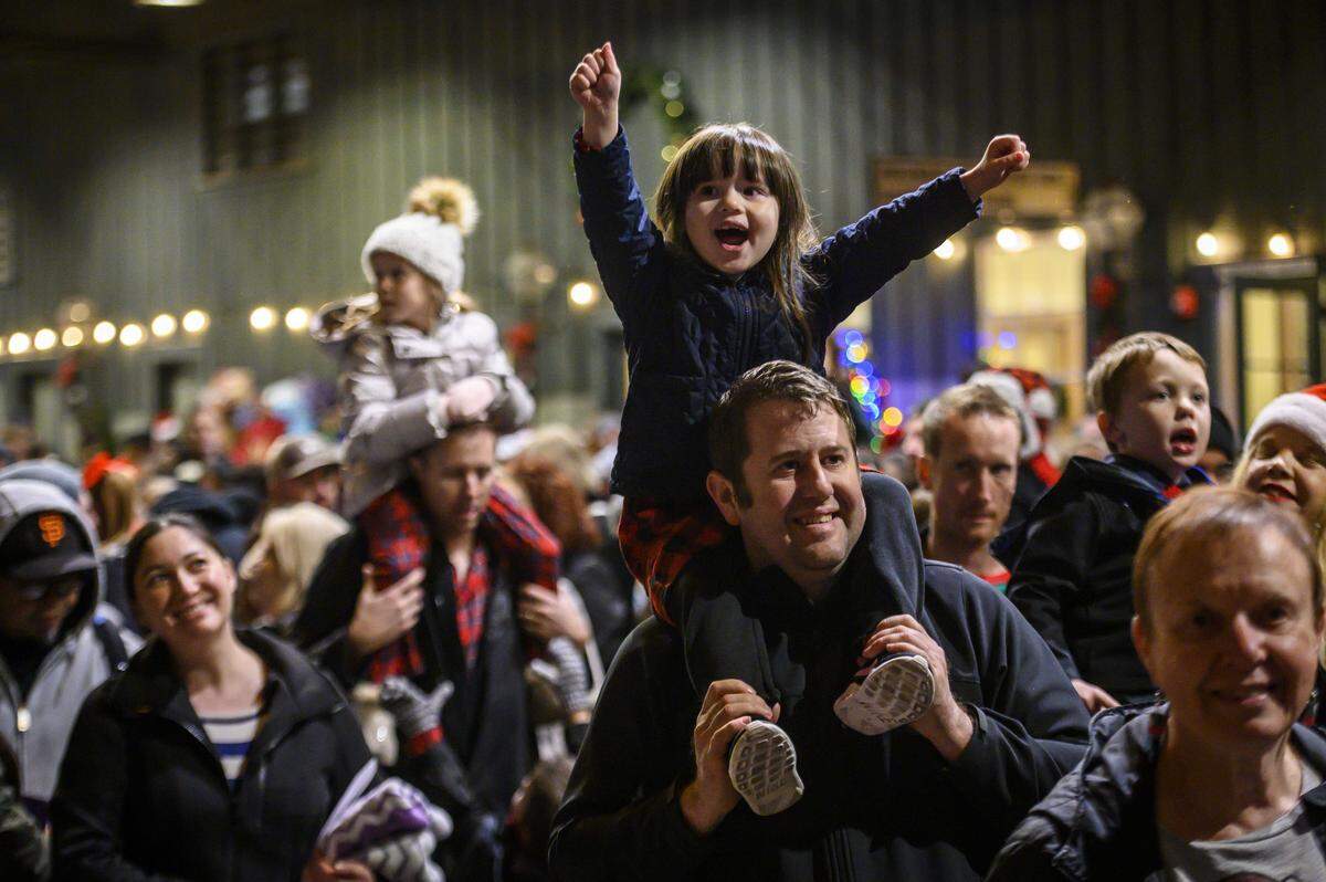 Layla Ludlow, 4, raises her hands as The Polar Express train arrives at the station in Old Sacramento on Dec. 18, 2019. The Sacramento holiday attraction returns this year with rides running from Nov. 14 through Dec. 21.
