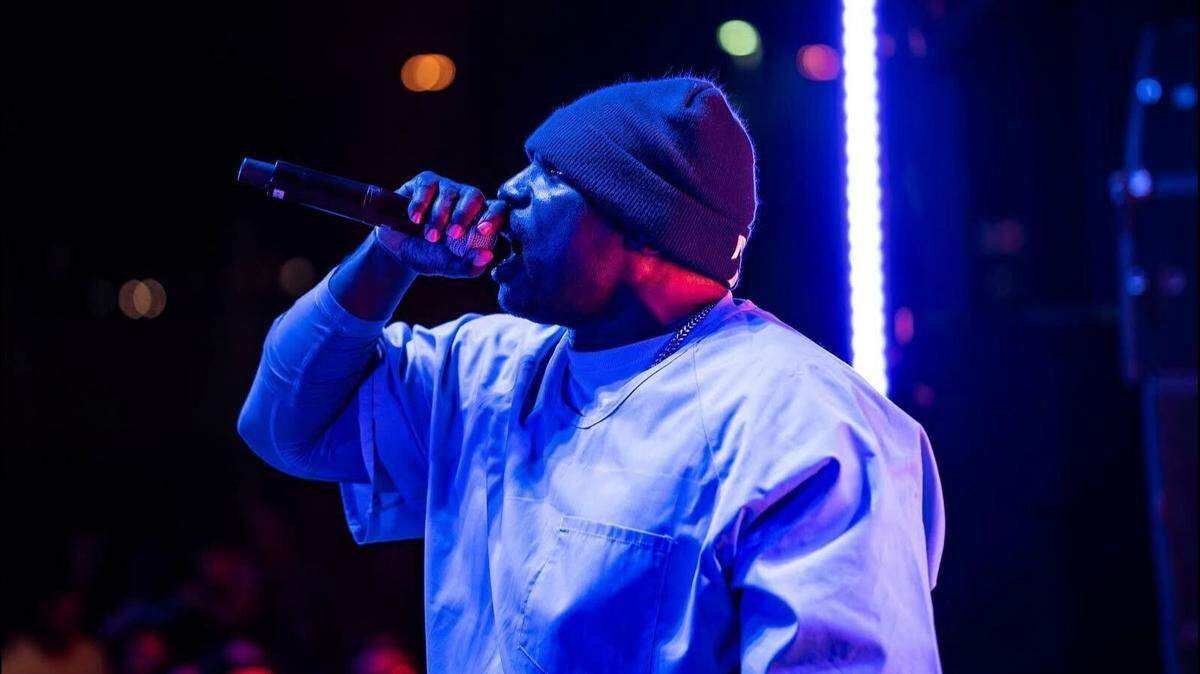 Sacramento artist, X-Raided, performs during a concert.