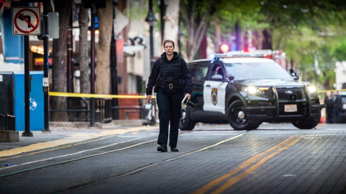 Sacramento Police Chief Kathy Lester walks the scene of the mass shooting in downtown Sacramento on Sunday, April 3, 2022.