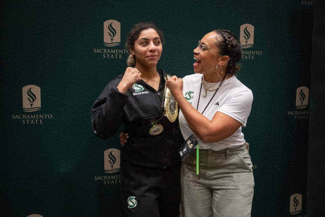 Sacramento State]s Ayahna Gonzales and her mother Janelle stand for a photo after her victory during the Causeway Boxing Classic at Memorial Auditorium on Friday.
