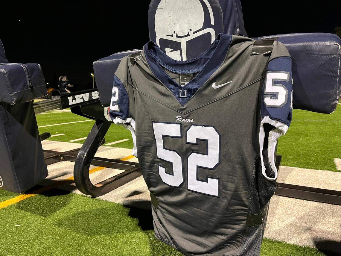 Julian Snyder's jersey is displayed Monday at a vigil at Casa Roble High School in Orangevale for a vigil for the senior football player, who died Friday in a vehicle crash in Roseville.