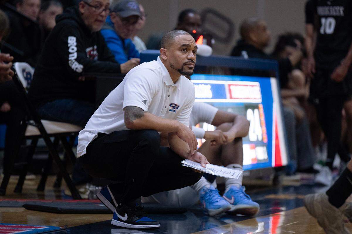 Christian Brothers head coach Jermaine Brown watches the Falcons defend Woodcreek on Thursday, Jan. 9, 2025 at Christian Brothers.