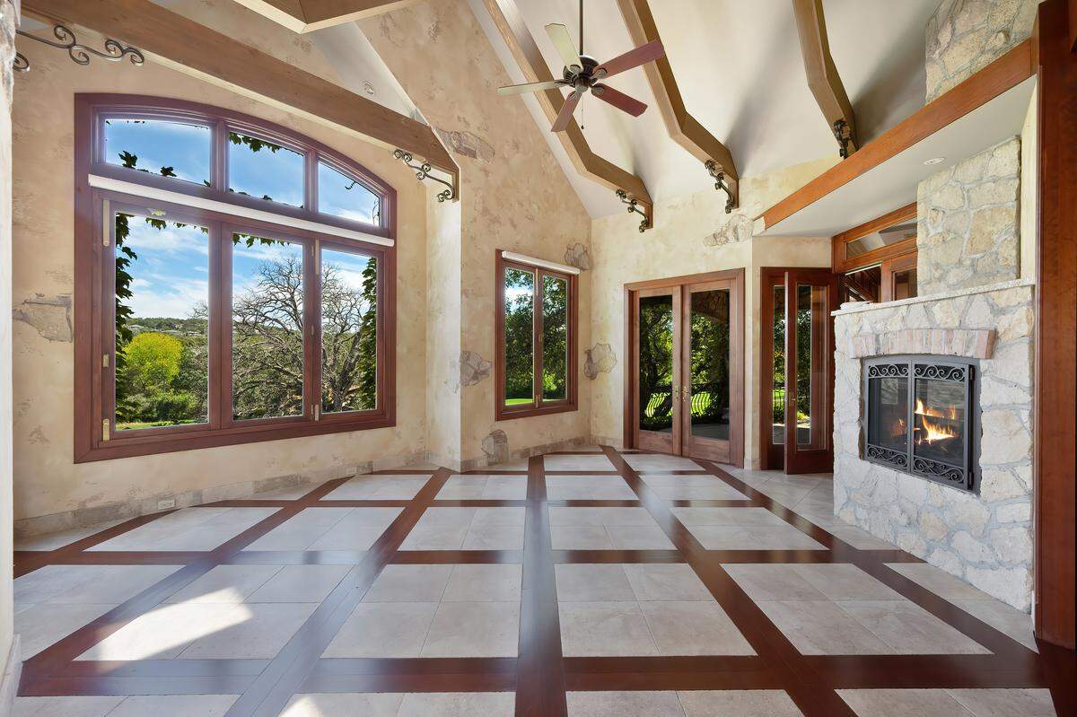 The well-lit, wood cross-beamed solarium.