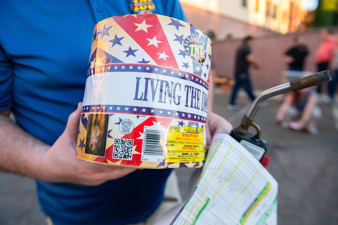 TNT Fireworks’ Aaron Crawford displays the “Safe and Sane” fireworks seal on the Living the Dream fountain, located above the QR code, on Monday, June 24, 2024, at Sacramento Fire Department Station 4 in Sacramento. Crawford said all fireworks in the state of of California must have this seal, which is issued by the state’s Fire Marshal.